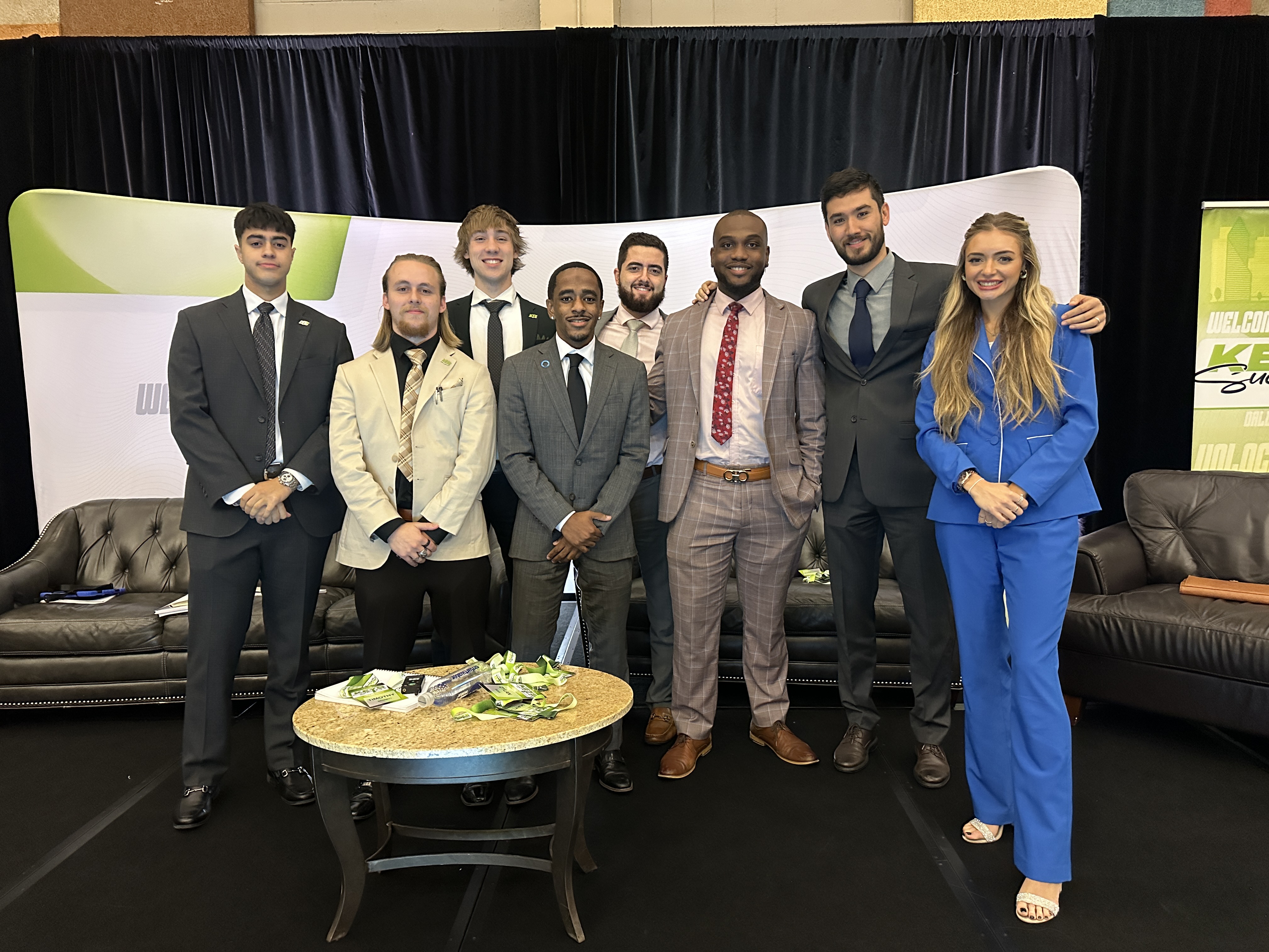 Visionary Insights team members dressed professionally at an industry event
